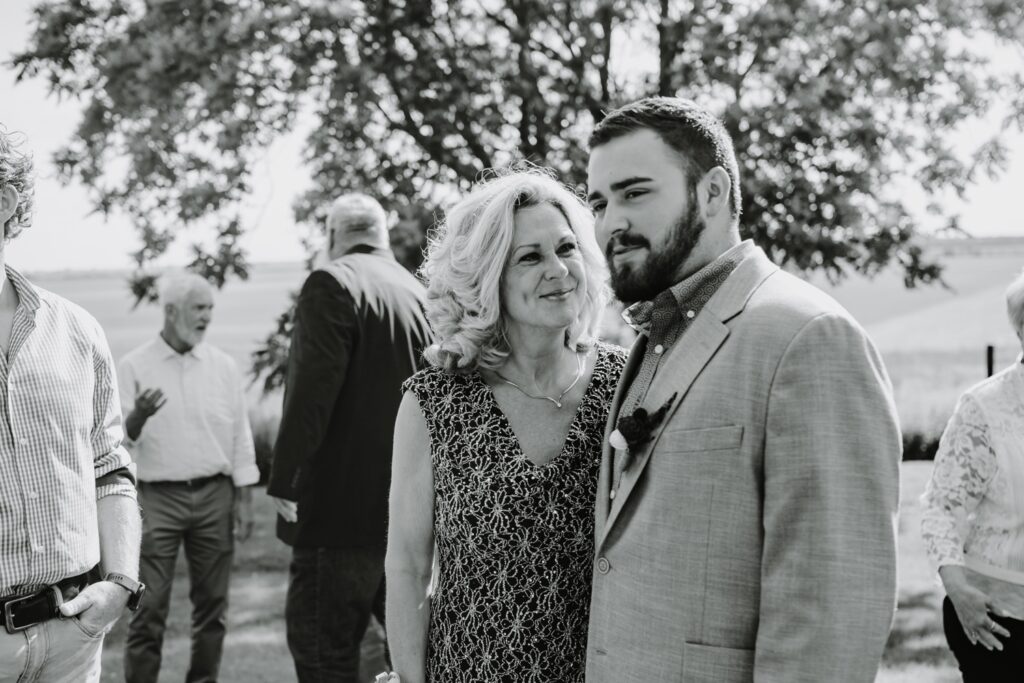 Groom and mother at rustic Reichert's Barn wedding ceremony