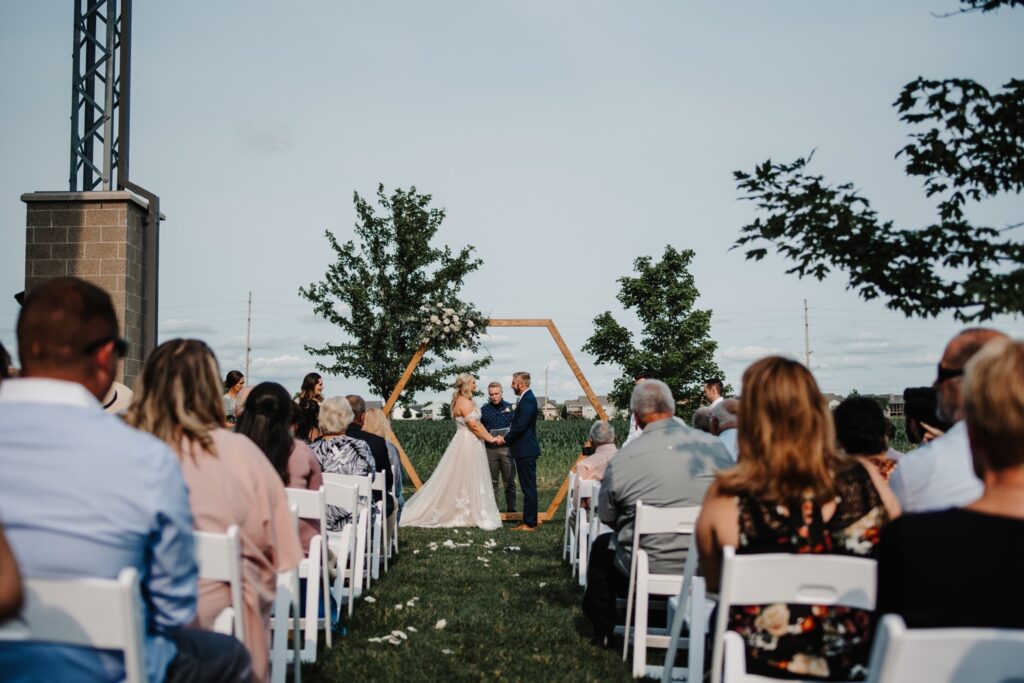 Bride and groom share vows at Destihl Brewery Wedding