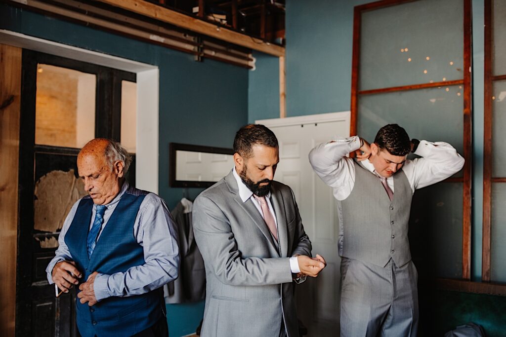 Groomsmen getting ready for wedding at the Legacy Building