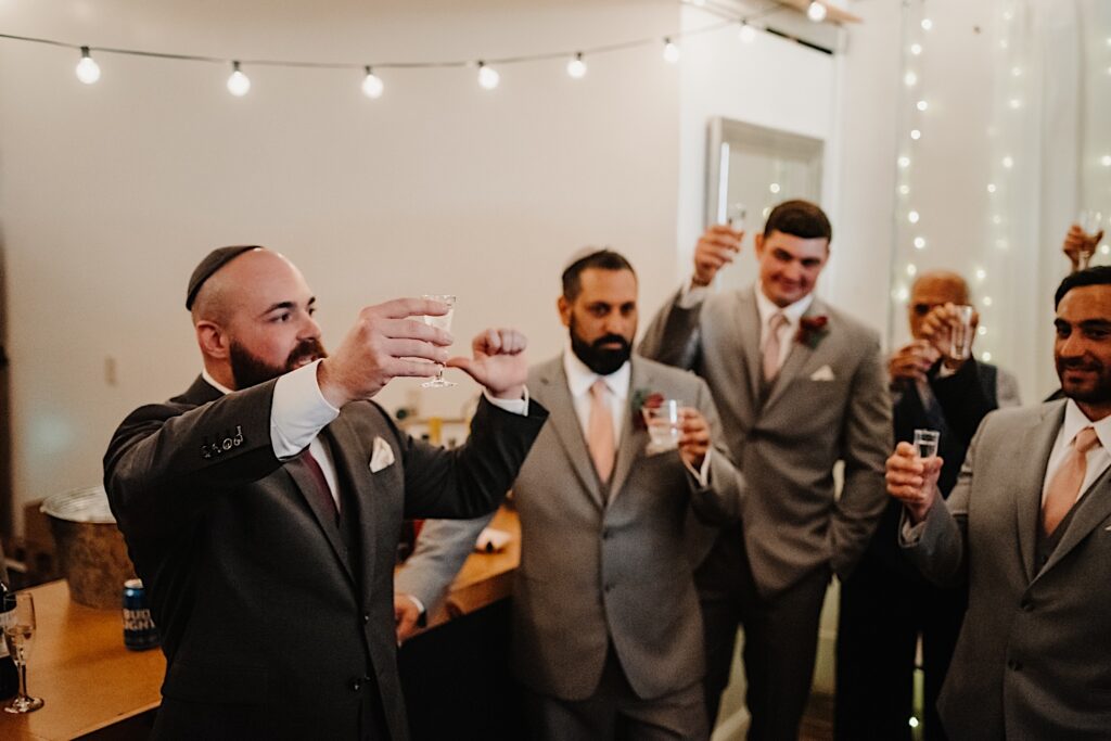 Groom gives a toast to wedding party in the Legacy Building