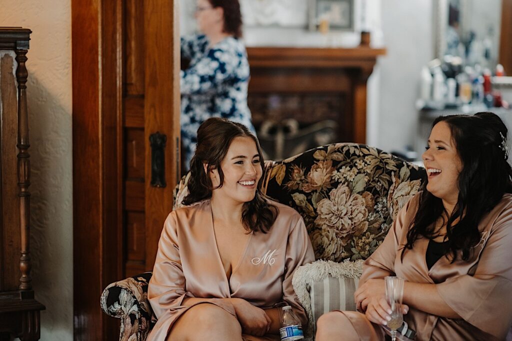 Two bridesmaids sit in an Inn in Chicago while the bride gets ready.