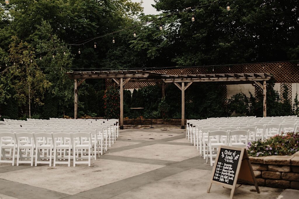 The outdoor space of the Ivy House set up for a wedding ceremony.