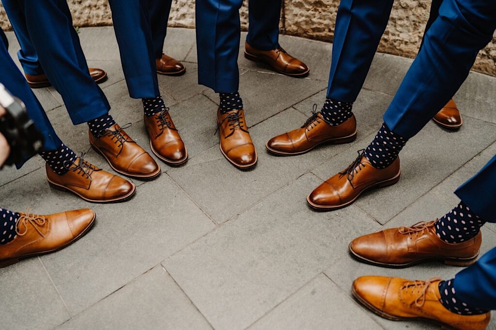 The groom and his groomsmen with their matching shoes and socks.