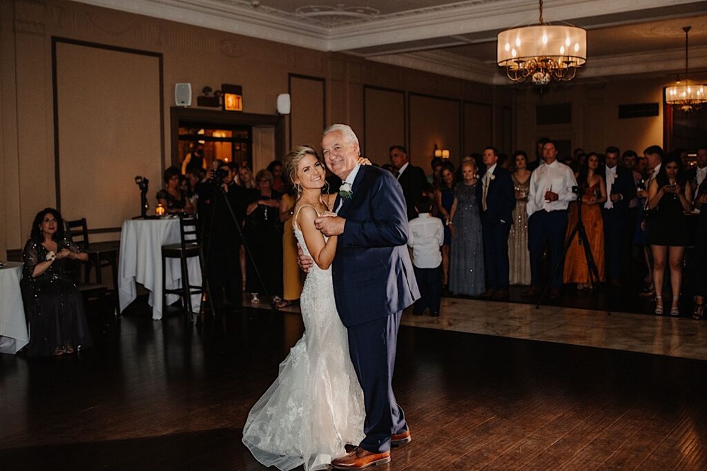 A bride and her father dance together during a wedding reception at Salvatore's in Chicago