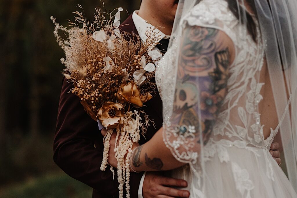 Close up photo of a bride and groom embracing during their fall wedding in Chicago