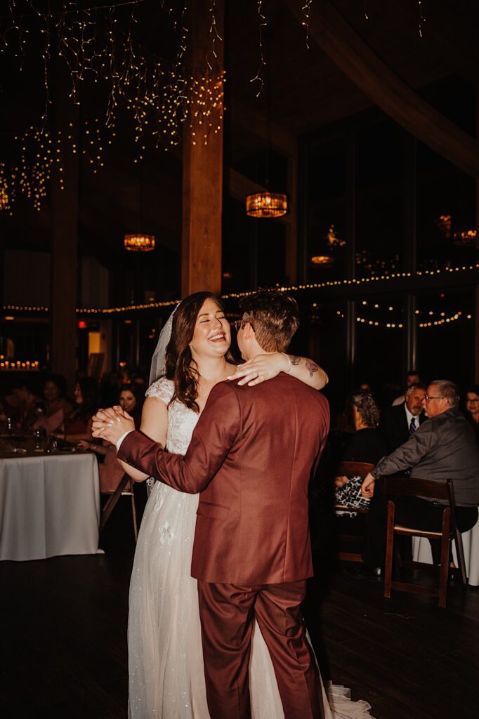 A bride and groom share their first dance during their wedding reception at the Oakbrook Bath and Tennis Club