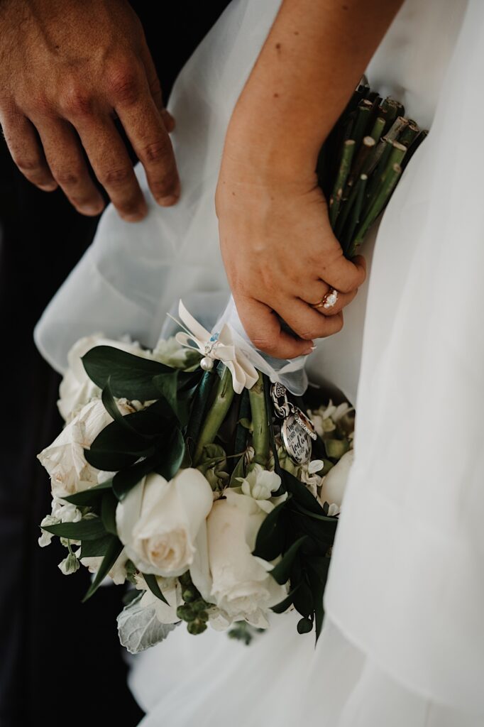Detail photo of a flower bouquet being held by a bride
