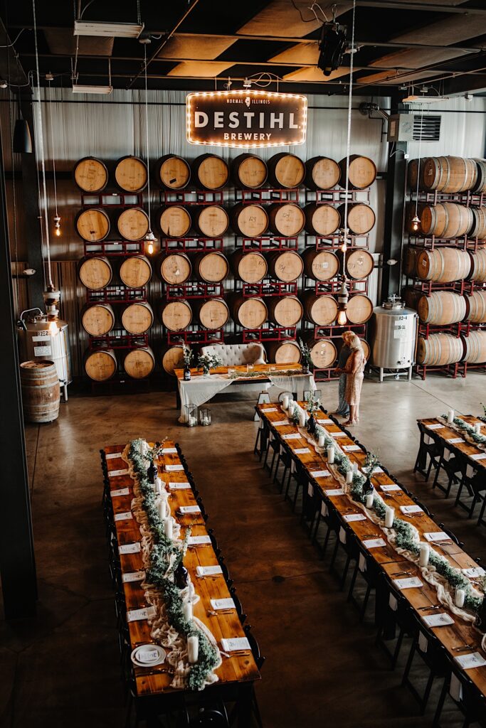 Destihl Brewery's interior barrel room set up and decorated for a wedding reception