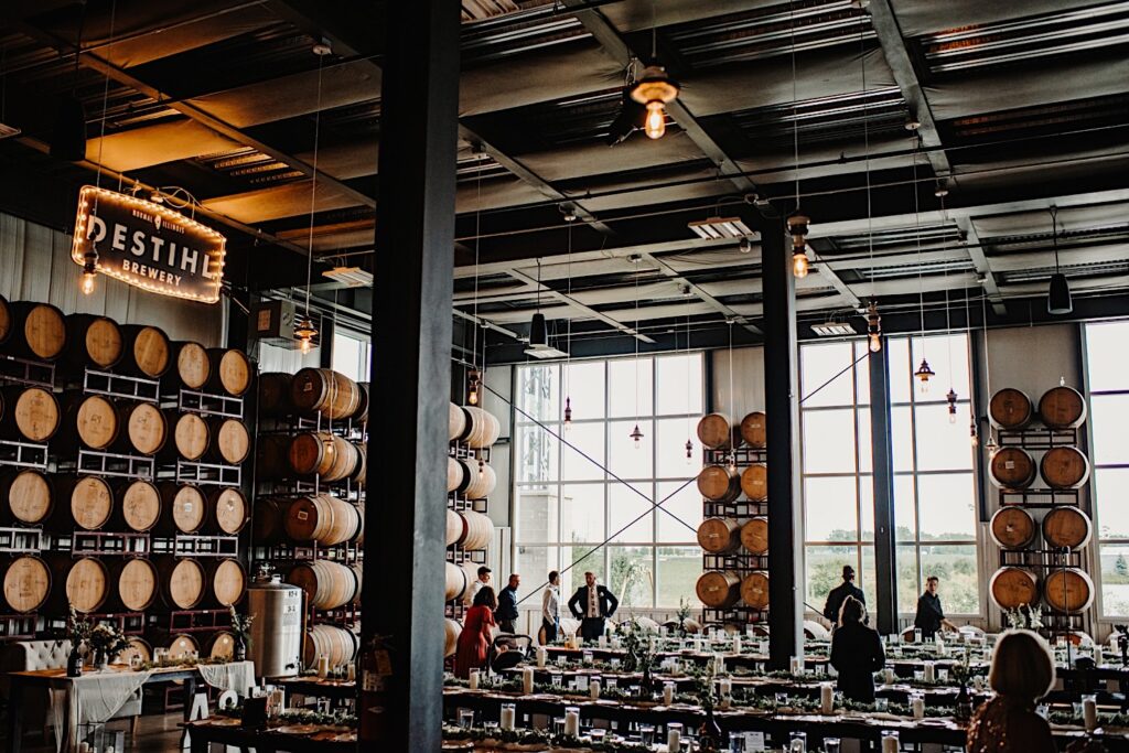 The indoor barrel room of the Destihl Brewery set up as a venue space for a wedding reception