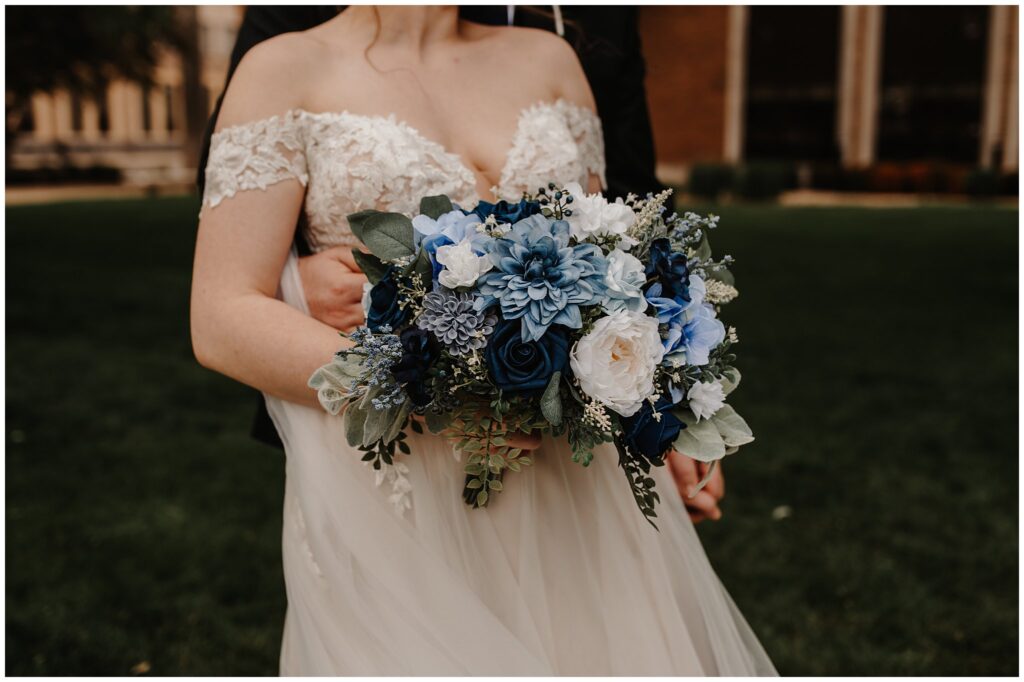 close up photography of blue and white wedding florals at a wedding at the castle theater in bloomington illinois